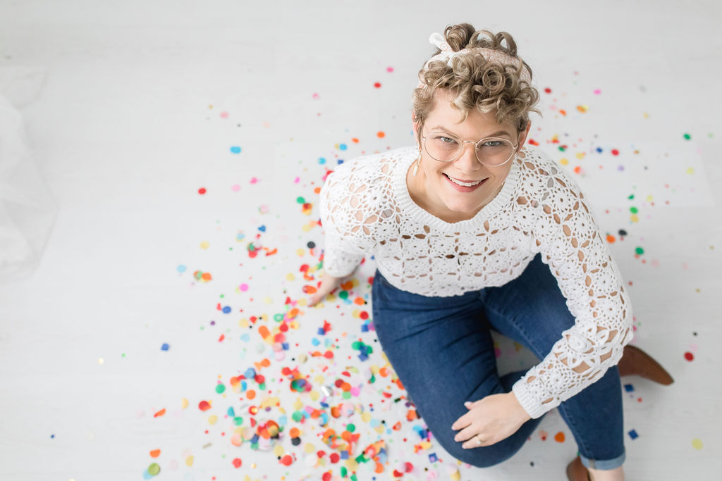 Blonde girl surrounded by confetti Photography